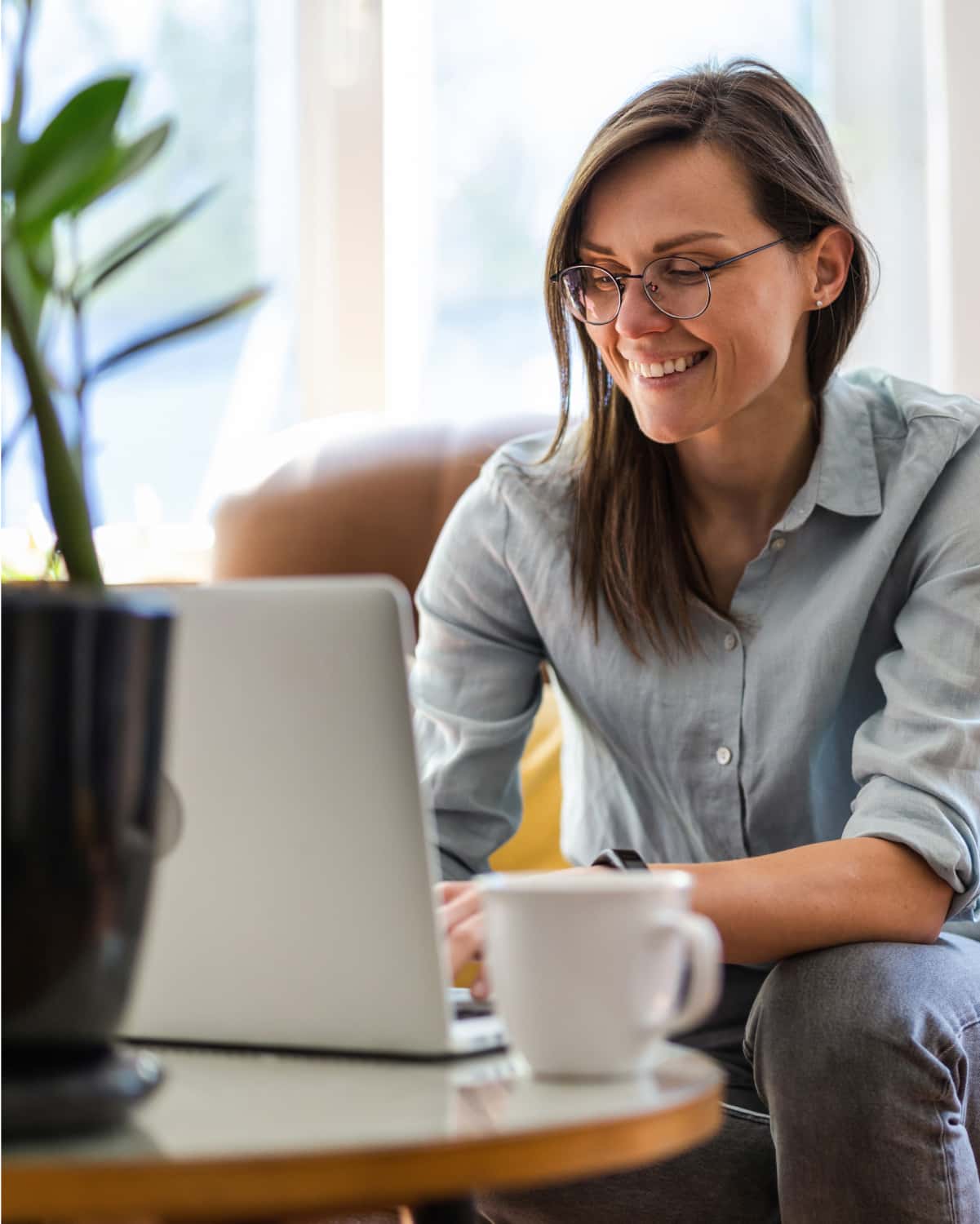 Woman smiling while using her computer. 