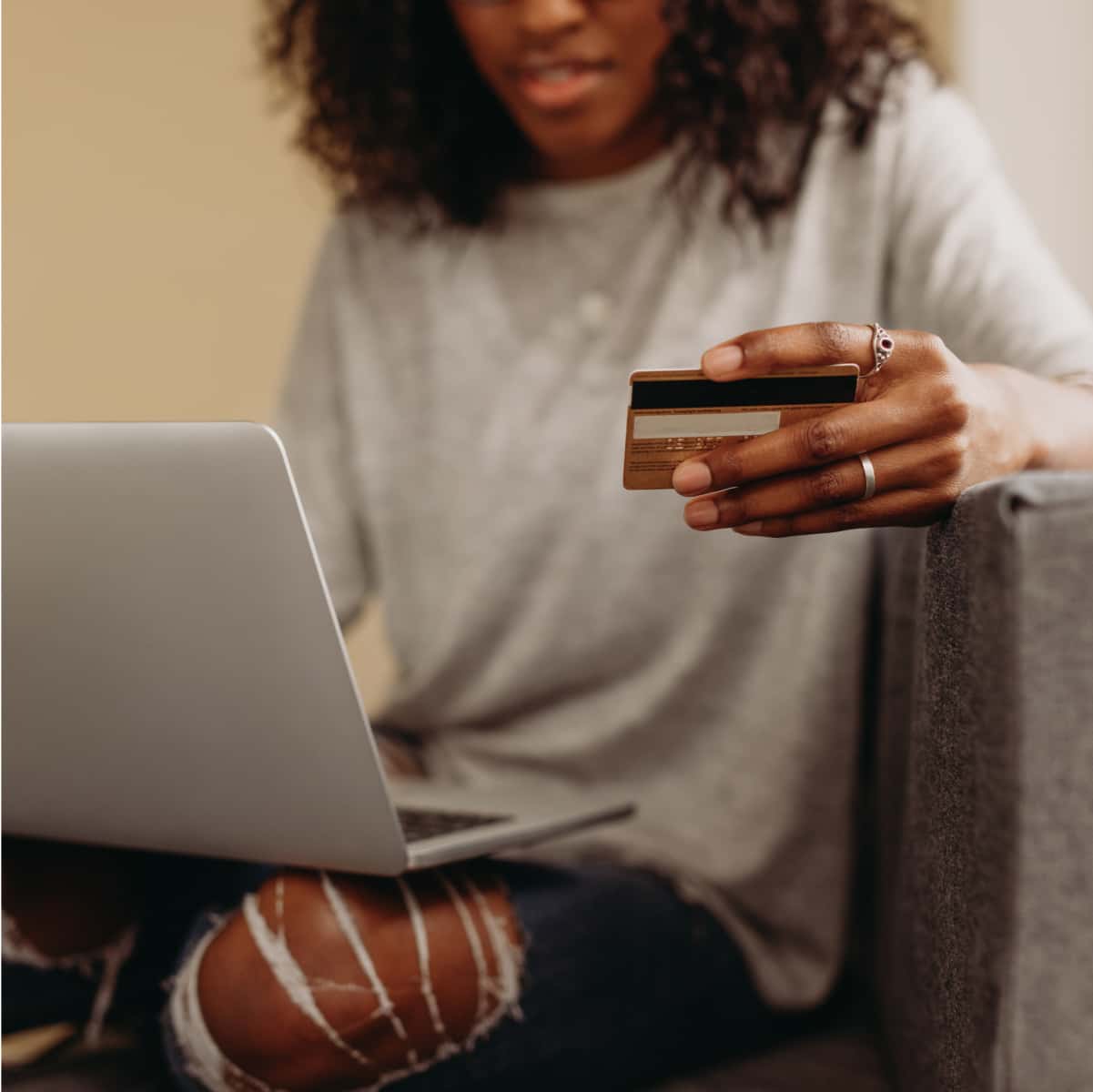 Someone paying on computer with card information.